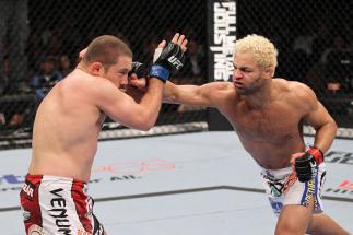 LAS VEGAS, NV - FEBRUARY 04: Josh Koscheck (right) punches Mike Pierce during the UFC 143 event at Mandalay Bay Events Center on February 4, 2012 in Las Vegas, Nevada. (Photo by Nick Laham/Zuffa LLC/Zuffa LLC via Getty Images) *** Local Caption *** Josh