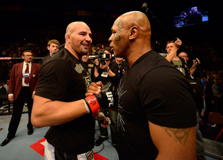 LAS VEGAS, NV - MAY 25: (R-L) Former professional boxer Mike Tyson congratulates Glover Teixeira in his victory over James Te-Huna in their light heavyweight bout during UFC 160 at the MGM Grand Garden Arena on May 25, 2013 in Las Vegas, Nevada. (Photo
