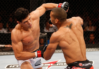 RIO DE JANEIRO, BRAZIL - AUGUST 03: (L-R) Cezar "Mutante" Ferreira punches Thiago "Marreta" Santos in their middleweight bout during UFC 163 at HSBC Arena on August 3, 2013 in Rio de Janeiro, Brazil. (Photo by Josh Hedges/Zuffa LLC/Zuffa LLC via Getty Im