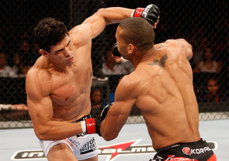 RIO DE JANEIRO, BRAZIL - AUGUST 03:  (L-R) Cezar "Mutante" Ferreira punches Thiago "Marreta" Santos in their middleweight bout during UFC 163 at HSBC Arena on August 3, 2013 in Rio de Janeiro, Brazil. (Photo by Josh Hedges/Zuffa LLC/Zuffa LLC via Getty Im