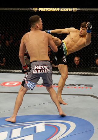 SAN JOSE, CA - APRIL 20:   (R-L) Josh Thomson kicks Nate Diaz in their lightweight bout during the UFC on FOX event at the HP Pavilion on April 20, 2013 in San Jose, California.  (Photo by Ezra Shaw/Zuffa LLC/Zuffa LLC via Getty Images)  *** Local Caption