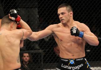 OMAHA, NE - FEBRUARY 15: (R-L) Jake Ellenberger punches Diego Sanchez during the UFC on FUEL TV event at Omaha Civic Auditorium on February 15, 2012 in Omaha, Nebraska. (Photo by Josh Hedges/Zuffa LLC/Zuffa LLC via Getty Images) *** Local Caption *** Ja