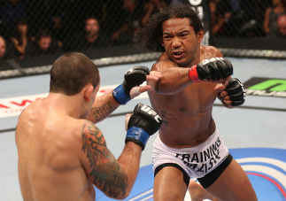 DENVER, CO - AUGUST 11: (R-L) Benson Henderson punches Frankie Edgar during their lightweight championship bout at UFC 150 inside Pepsi Center on August 11, 2012 in Denver, Colorado. (Photo by Nick Laham/Zuffa LLC/Zuffa LLC via Getty Images)