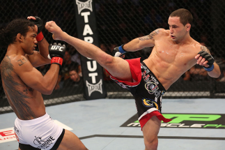 DENVER, CO - AUGUST 11: (R-L) Frankie Edgar kicks Benson Henderson during their lightweight championship bout at UFC 150 inside Pepsi Center on August 11, 2012 in Denver, Colorado. (Photo by Nick Laham/Zuffa LLC/Zuffa LLC via Getty Images)