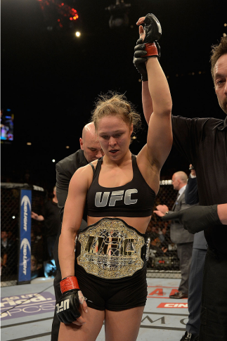 LAS VEGAS, NV - DECEMBER 28: Ronda Rousey reacts to her victory over Miesha Tate in their UFC women's bantamweight championship bout during the UFC 168 event at the MGM Grand Garden Arena on December 28, 2013 in Las Vegas, Nevada. (Photo by Donald Mirall
