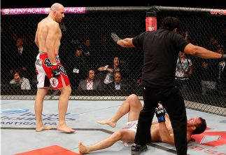 BELO HORIZONTE, BRAZIL - SEPTEMBER 04:  Glover Teixeira (L) reacts after knocking out Ryan Bader in their light heavyweight fight during the UFC on FOX Sports 1 event at Mineirinho Arena on September 4, 2013 in Belo Horizonte, Brazil. (Photo by Josh Hedge