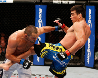 ANAHEIM, CA - FEBRUARY 23: (R-L) Lyoto Machida kicks Dan Henderson in their light heavyweight bout during UFC 157 at Honda Center on February 23, 2013 in Anaheim, California. (Photo by Josh Hedges/Zuffa LLC/Zuffa LLC via Getty Images) *** Local Caption