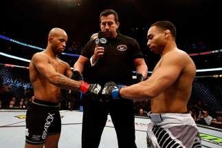 CHICAGO, IL - JANUARY 26: John Dodson (R) taps gloves with Demetrious Johnson (L) during thier Flyweight Championship Bout part of UFC on FOX at United Center on January 26, 2013 in Chicago, Illinois. (Photo by Josh Hedges/Zuffa LLC/Zuffa LLC Via Getty