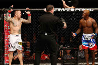 MANCHESTER, ENGLAND - OCTOBER 26: Ross Pearson (L) and Melvin Guillard (R) are separated by referee Mark Goddard after an illegal knee strike by Guillard their lightweight bout during the UFC Fight Night event at Phones 4 U Arena on October 26, 2013 in M