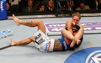 ANAHEIM, CA - FEBRUARY 23: Ronda Rousey (right) attempts to submit Liz Carmouche in their women's bantamweight title fight during UFC 157 at Honda Center on February 23, 2013 in Anaheim, California. (Photo by Josh Hedges/Zuffa LLC/Zuffa LLC via Getty Im