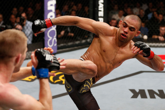 LONDON, ENGLAND - FEBRUARY 16: (R-L) Renan Barao kicks Michael McDonald in their interim bantamweight title fight during the UFC on Fuel TV event on February 16, 2013 at Wembley Arena in London, England. (Photo by Josh Hedges/Zuffa LLC/Zuffa LLC via Get