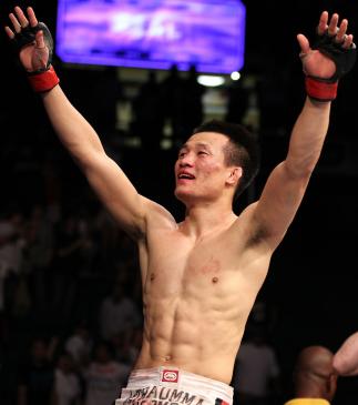 FAIRFAX, VA - MAY 15: "The Korean Zombie" Chan Sung Jung reacts after defeating Dustin Poirier in a featherweight bout during the UFC on Fuel TV event at Patriot Center on May 15, 2012 in Fairfax, Virginia. (Photo by Josh Hedges/Zuffa LLC/Zuffa LLC via