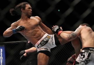 SAITAMA, JAPAN - FEBRUARY 26: (L-R) Benson Henderson kicks Frankie Edgar during the UFC 144 event at Saitama Super Arena on February 26, 2012 in Saitama, Japan. (Photo by Josh Hedges/Zuffa LLC/Zuffa LLC via Getty Images) *** Local Caption *** Frankie Ed