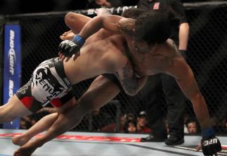 SAITAMA, JAPAN - FEBRUARY 26: (L-R) Frankie Edgar takes down Benson Henderson during the UFC 144 event at Saitama Super Arena on February 26, 2012 in Saitama, Japan. (Photo by Josh Hedges/Zuffa LLC/Zuffa LLC via Getty Images) *** Local Caption *** Frank