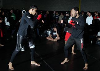 TORONTO, ON - DECEMBER 07: (L-R) Twin brothers Antonio Rodrigo "Minotauro" Nogueira and Antonio Rogerio "Minotoro" Nogueira workout together during the UFC 140 Open Workouts at the Xtreme Couture Gym on December 7, 2011 in Toronto, Ontario. (Photo by Jo
