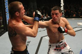LAS VEGAS, NV - DECEMBER 30: Nate Diaz (right) punches Donald Cerrone during the UFC 141 event at the MGM Grand Garden Arena on December 30, 2011 in Las Vegas, Nevada. (Photo by Donald Miralle/Zuffa LLC/Zuffa LLC via Getty Images) *** Local Caption ***