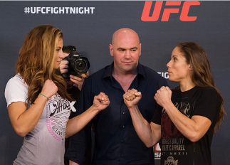 ORLANDO, FL - APRIL 17: (L-R) Opponents Miesha Tate and Liz Carmouche face off during the FOX UFC Saturday pre-fight press conference at Shaquille O'Neal's estate on April 17, 2014 in Orlando, Florida. (Photo by Mike Roach/Zuffa LLC/Zuffa LLC via Getty I