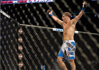 MILWAUKEE, WI - AUGUST 31: Al Iaquinta celebrates after round one between Ryan Couture (not pictured) in their UFC lightweight bout at BMO Harris Bradley Center on August 31, 2013 in Milwaukee, Wisconsin. (Photo by Jeff Bottari/Zuffa LLC/Zuffa LLC via Ge
