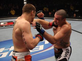 NASHVILLE, TN - JANUARY 20: (L-R) Duane Ludwig punches Josh Neer during the UFC on FX event at Bridgestone Arena on January 20, 2012 in Nashville, Tennessee. (Photo by Josh Hedges/Zuffa LLC/Zuffa LLC via Getty Images)