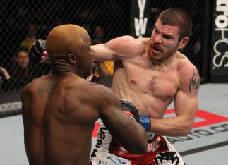 NASHVILLE, TN - JANUARY 20:  (R-L) Jim Miller punches Melvin Guillard during the UFC on FX event at Bridgestone Arena on January 20, 2012 in Nashville, Tennessee.  (Photo by Josh Hedges/Zuffa LLC/Zuffa LLC via Getty Images)