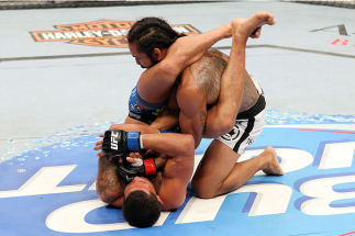 MILWAUKEE, WI - AUGUST 31: (L-R) Anthony Pettis puts Benson Henderson in an armbar in their UFC lightweight championship bout at BMO Harris Bradley Center on August 31, 2013 in Milwaukee, Wisconsin. (Photo by Ed Mulholland/Zuffa LLC/Zuffa LLC via Getty I