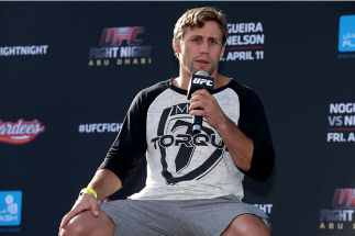 ABU DHABI, UNITED ARAB EMIRATES - APRIL 10: UFC fighter Urijah Faber answers questions during a Q&A after the weighs-in for UFC Fight Night 39 on April 10, 2014 in Abu Dhabi, United Arab Emirates. UFC Fight Night 39 will take place on April 11 at du Aren