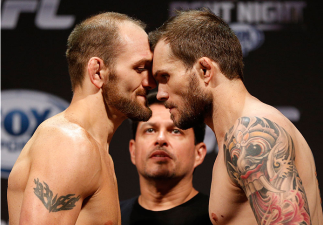 INDIANAPOLIS, IN - AUGUST 27:  (L-R) Opponents Zak Cummings and Benny Alloway face off during the UFC weigh-in event at Bankers Life Fieldhouse on August 27, 2013 in Indianapolis, Indiana. (Photo by Josh Hedges/Zuffa LLC/Zuffa LLC via Getty Images)