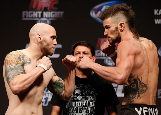 INDIANAPOLIS, IN - AUGUST 27:  (L-R) Opponents Justin Edwards and Brandon Thatch face off during the UFC weigh-in event at Bankers Life Fieldhouse on August 27, 2013 in Indianapolis, Indiana. (Photo by Josh Hedges/Zuffa LLC/Zuffa LLC via Getty Images)