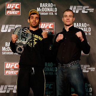 LONDON, ENGLAND - FEBRUARY 13: (L-R) Opponents Renan Barao and Michael McDonald pose for photos during a UFC press conference on February 13, 2013 at Hooks Gym in London, England. (Photo by Josh Hedges/Zuffa LLC/Zuffa LLC via Getty Images)