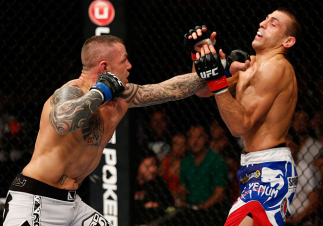 GOLD COAST, AUSTRALIA - DECEMBER 15:  (L-R) Ross Pearson punches George Sotiropoulos during their lightweight fight at the UFC on FX event on December 15, 2012  at Gold Coast Convention and Exhibition Centre in Gold Coast, Australia.  (Photo by Josh Hedge