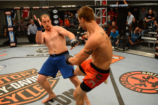LAS VEGAS, NV - OCTOBER 16: (R-L) Matt Van Buren kicks Daniel Vizcaya in their elimination fight during filming of season nineteen of The Ultimate Fighter on October 16, 2013 in Las Vegas, Nevada. (Photo by Al Powers/Zuffa LLC/Zuffa LLC via Getty Images)