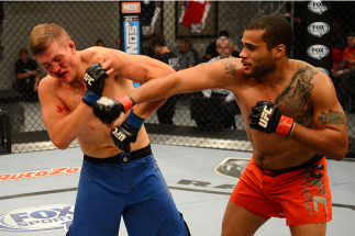 LAS VEGAS, NV - OCTOBER 16: (R-L) Roger Zapata punches Tyler Minton in their elimination fight during filming of season nineteen of The Ultimate Fighter on October 16, 2013 in Las Vegas, Nevada. (Photo by Al Powers/Zuffa LLC/Zuffa LLC via Getty Images) *