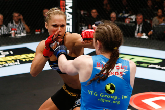 SAN DIEGO, CA - AUGUST 18: (L-R) Ronda Rousey punches Sarah Kaufman during the Strikeforce event at Valley View Casino Center on August 18, 2012 in San Diego, California. (Photo by Esther Lin/Forza LLC/Forza LLC via Getty Images)