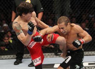 SAN JOSE, CA - NOVEMBER 19: (R-L) Urijah Faber has his punch blocked by Brian Bowles knee during an UFC Bantamweight bout at the HP Pavillion on November 19, 2011 in San Jose, California. (Photo by Josh Hedges/Zuffa LLC/Zuffa LLC via Getty Images)