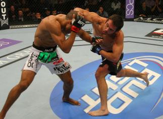 LAS VEGAS, NV - MAY 26: Jamie Varner (R) punches Edson Barboza during a lightweight bout at UFC 146 at MGM Grand Garden Arena on May 26, 2012 in Las Vegas, Nevada. (Photo by Donald Miralle/Zuffa LLC/Zuffa LLC via Getty Images)