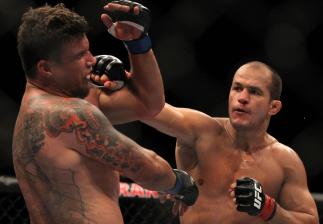 LAS VEGAS, NV - MAY 26: (R-L) Junior dos Santos punches Frank Mir during the Heavyweight Championship bout at UFC 146 at MGM Grand Garden Arena on May 26, 2012 in Las Vegas, Nevada. (Photo by Josh Hedges/Zuffa LLC/Zuffa LLC via Getty Images)