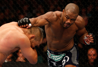WINNIPEG, CANADA - JUNE 15: (R-L) Rashad Evans punches Dan Henderson in their light heavyweight fight during the UFC 161 event at the MTS Centre on June 15, 2013 in Winnipeg, Manitoba, Canada. (Photo by Josh Hedges/Zuffa LLC/Zuffa LLC via Getty Images)