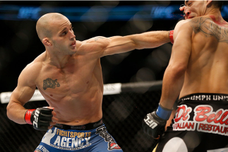 TORONTO, CANADA - SEPTEMBER 21: (L-R) Mitch Gagnon punches Dustin Kimura in their UFC bantamweight bout at the Air Canada Center on September 21, 2013 in Toronto, Ontario, Canada. (Photo by Josh Hedges/Zuffa LLC/Zuffa LLC via Getty Images) *** Local Capt