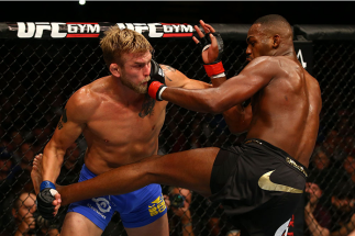 TORONTO, CANADA - SEPTEMBER 21: (R-L) Jon Jones punches Alexander Gustafsson in their UFC light heavyweight championship bout at the Air Canada Center on September 21, 2013 in Toronto, Ontario, Canada. (Photo by Al Bello/Zuffa LLC/Zuffa LLC via Getty Ima