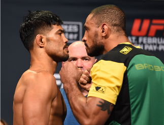 LOS ANGELES, CA - FEBRUARY 27: (L-R) Opponents Mark Munoz and Roan Carneiro of Brazil face off during the UFC 184 weigh-in at the Event Deck and LA Live on February 27, 2015 in Los Angeles, California. (Photo by Josh Hedges/Zuffa LLC/Zuffa LLC via Getty