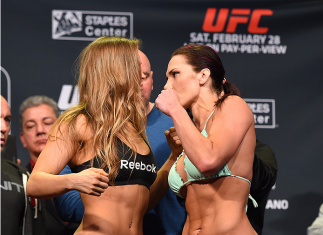 LOS ANGELES, CA - FEBRUARY 27:  (L-R) Opponents Ronda Rousey and Cat Zingano face off during the UFC 184 weigh-in at the Event Deck and LA Live on February 27, 2015 in Los Angeles, California. (Photo by Josh Hedges/Zuffa LLC/Zuffa LLC via Getty Images)