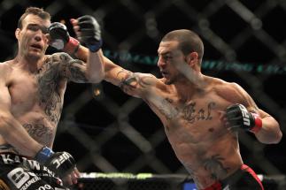 CHICAGO, IL - JANUARY 28:  (L-R) George Roop and Cub Swanson trade punches during the UFC on FOX event at United Center on January 28, 2012 in Chicago, Illinois.  (Photo by Josh Hedges/Zuffa LLC/Zuffa LLC via Getty Images) *** Local Caption *** Cub Swanso