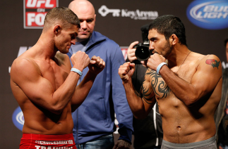 SEATTLE, WA - DECEMBER 07: (L-R) Opponents Daron Cruickshank and Henry Martinez face off during the official UFC on FOX weigh in on December 7, 2012 at Key Arena in Seattle, Washington. (Photo by Josh Hedges/Zuffa LLC/Zuffa LLC via Getty Images)