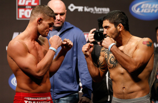 SEATTLE, WA - DECEMBER 07:  (L-R) Opponents Daron Cruickshank and Henry Martinez face off during the official UFC on FOX weigh in on December 7, 2012 at Key Arena in Seattle, Washington.  (Photo by Josh Hedges/Zuffa LLC/Zuffa LLC via Getty Images)