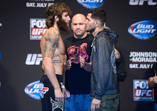 SEATTLE, WA - JULY 26: Opponents Michael Chiesa (L) and Jorge Masvidal face off during the official UFC on FOX weigh-in at Key Arena on July 26, 2013 in Seattle, Washington. (Photo by Jeff Bottari/Zuffa LLC/Zuffa LLC via Getty Images)