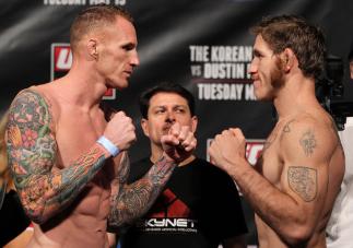 FAIRFAX, VA - MAY 14:  (L-R) Middleweight opponents Jason MacDonald and Tom Lawlor face off after weighing in during the UFC on Fuel TV official weigh in at Patriot Center on May 14, 2012 in Fairfax, Virginia.  (Photo by Josh Hedges/Zuffa LLC/Zuffa LLC vi