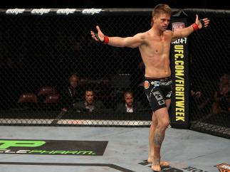SUNRISE, FL - JUNE 08: Mike Pyle celebrates after knocking out Josh Neer in a Welterweight bout during the UFC on FX 3 event at Bank Atlantic Center on June 8, 2012 in Sunrise, Florida. (Photo by Josh Hedges/Zuffa LLC/Zuffa LLC via Getty Images)