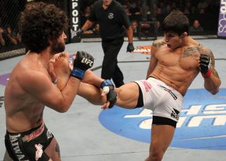 SUNRISE, FL - JUNE 08:   (R-L) Erick Silva kicks Charlie Brenneman in a Welterweight bout during the UFC on FX 3 event at Bank Atlantic Center on June 8, 2012 in Sunrise, Florida.  (Photo by Josh Hedges/Zuffa LLC/Zuffa LLC via Getty Images)