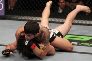 SUNRISE, FL - JUNE 08: (R-L) Erick Silva defeats Charlie Brenneman with a rear choke submission in a Welterweight bout during the UFC on FX 3 event at Bank Atlantic Center on June 8, 2012 in Sunrise, Florida. (Photo by Josh Hedges/Zuffa LLC/Zuffa LLC v