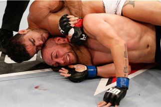 GOIANIA, BRAZIL - NOVEMBER 09: (L-R) Thiago Tavares secures a rear choke submission against Justin Salas in their lightweight bout during the UFC event at Arena Goiania on November 9, 2013 in Goiania, Brazil. (Photo by Josh Hedges/Zuffa LLC/Zuffa LLC via